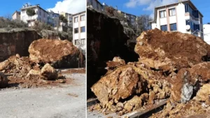 Balıkesir’de şiddetli yağış sonucu boş arsadaki büyük kaya parçası yaya kaldırımına düştü